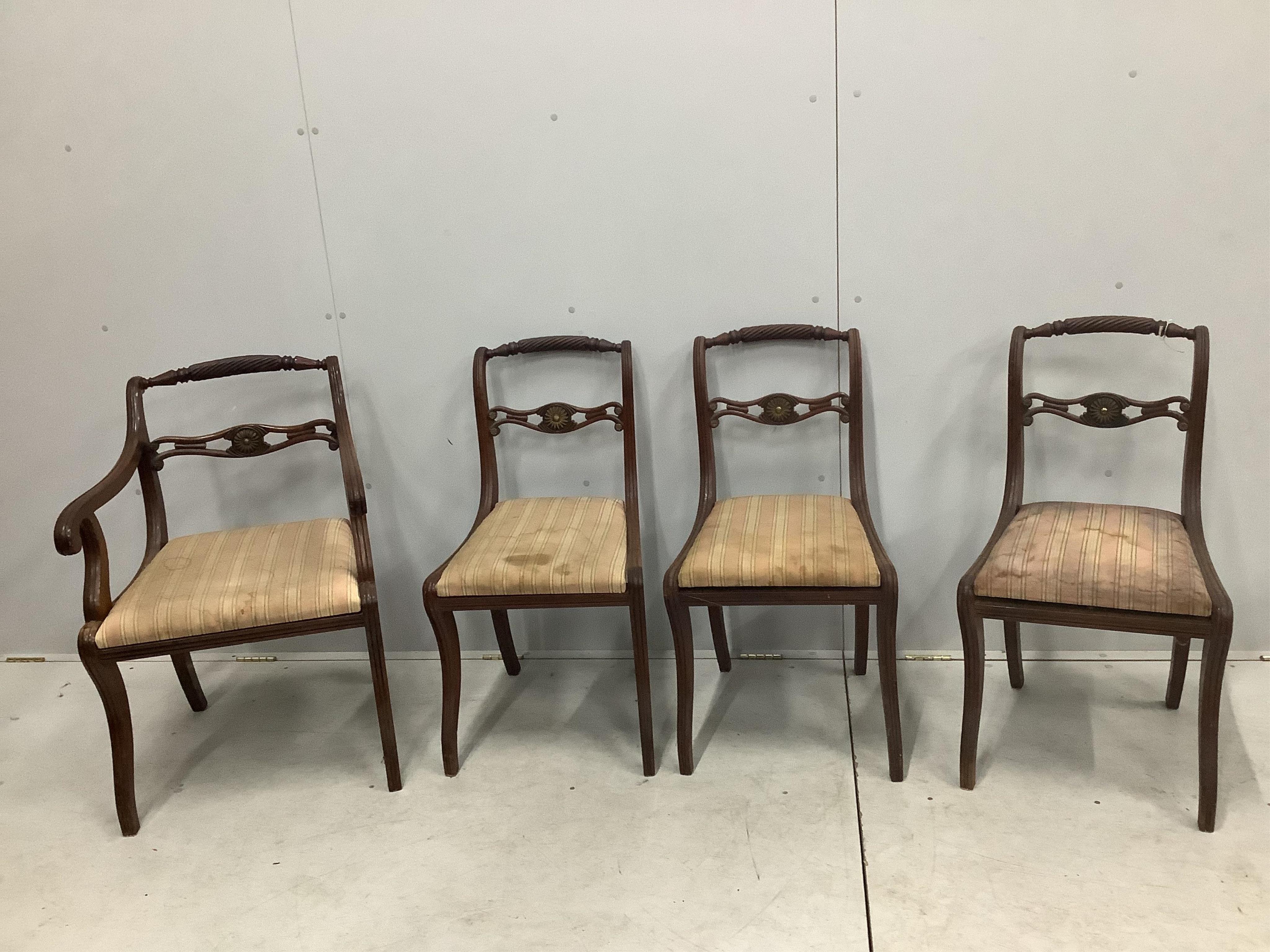 A set of eight Regency brass mounted mahogany dining chairs, one with arms. Condition - poor to fair, one lacking top rail